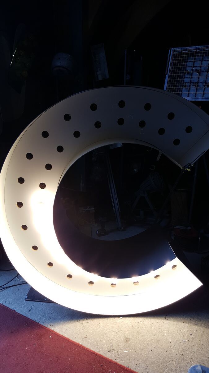The finished C lit in the workshop