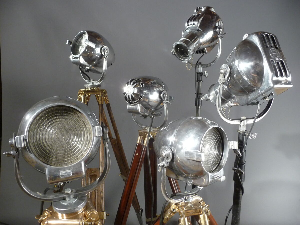 Group of restored studio spotlights on timber tripods