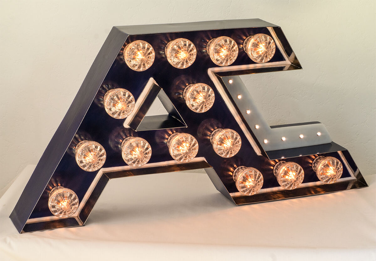 Marquee A and C monogram sign with globe bulbs