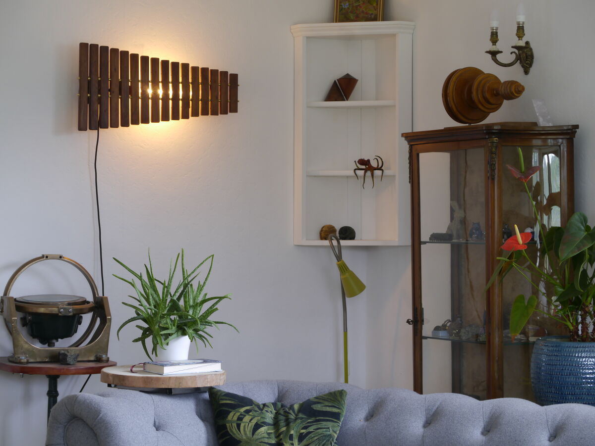 The xylophone wall light glowing above a living room